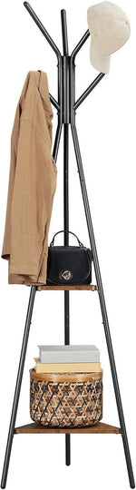 Black metal coat rack with wooden shelves, holding jacket, hat, handbag, and basket