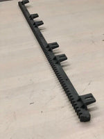 Black plastic tractor part with gear teeth and mounting tabs for AGCO or EATON equipment
