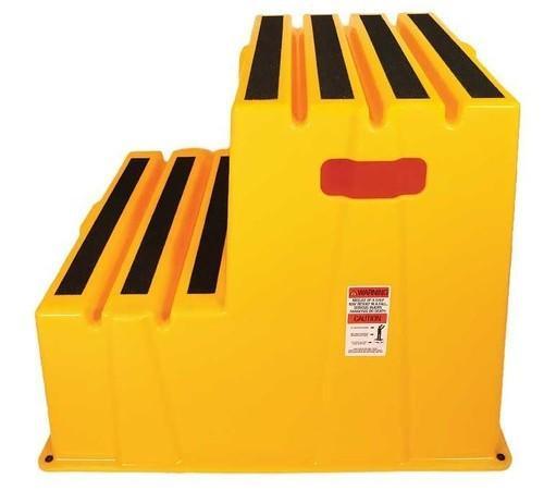 Yellow industrial step stool with black grip treads and red handle, safety warning label visible