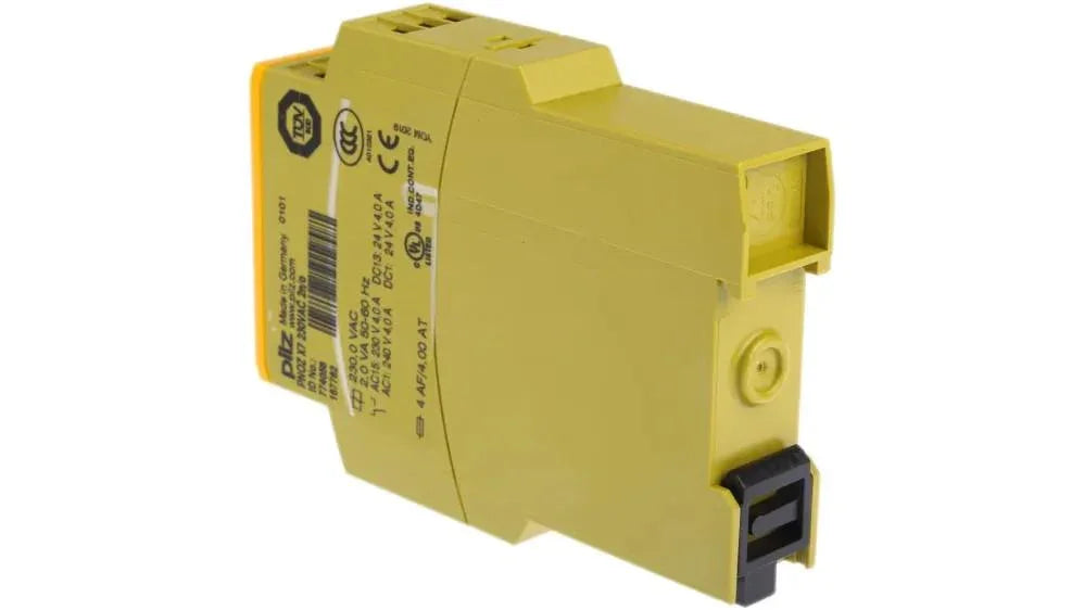 Yellow industrial safety relay with certification labels for automation systems
