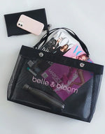 Black mesh tote bag with magazines, phone, and accessories, stylish everyday carry