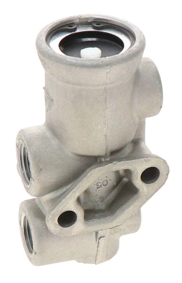 Close-up of metal tractor TP-3 valve with threaded ports, replacement part for machinery