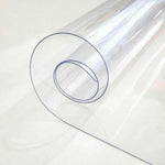 Transparent clear PVC table cover roll showing its flexible waterproof material