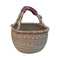 Handwoven seagrass basket with leather-wrapped handle, natural fiber storage or market tote