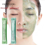 Woman with half face showing green peel-off jelly mask, kiwifruit oil control mask packets