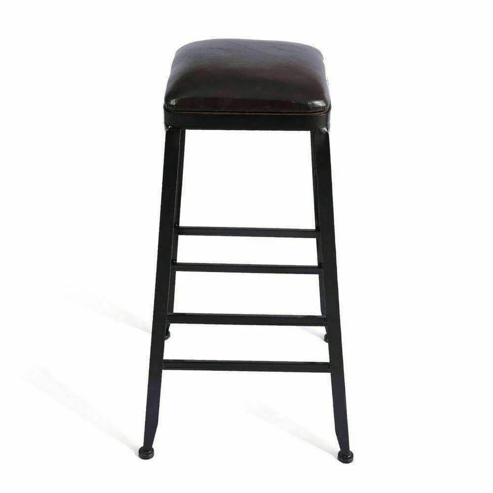 Industrial bar stool with black metal frame and brown leather seat on white background