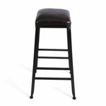 Industrial bar stool with black metal frame and brown leather seat on white background