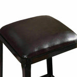 Industrial bar stool with black metal frame and square brown leather seat