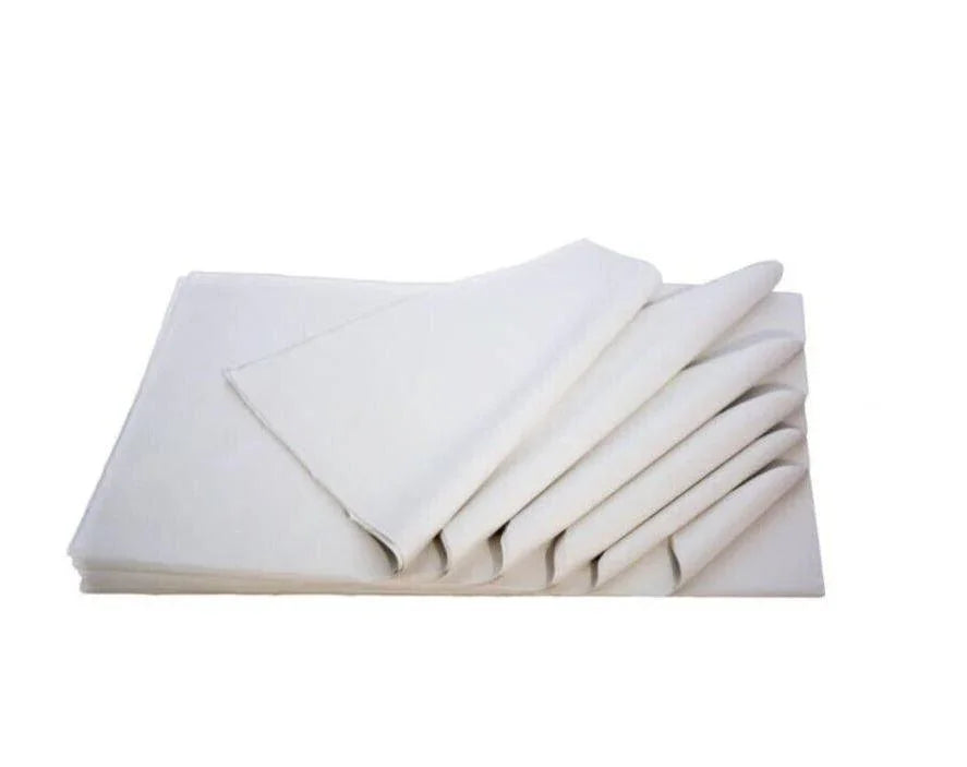 Stack of white acid-free tissue paper sheets for gift wrap or packaging on white background