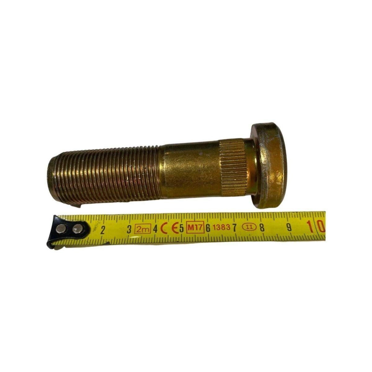 Threaded metal tractor stud bolt for Massey Ferguson, shown with measuring tape