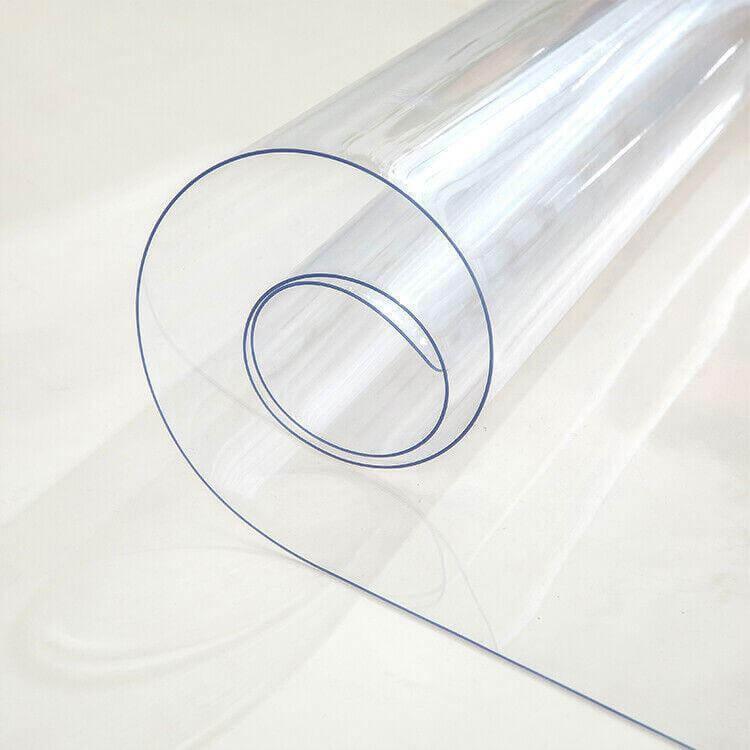 Clear rolled PVC tablecloth protector showcasing durable and waterproof material for table surface protection.