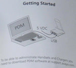 Diagram showing a laptop connected via USB to a charging dock labeled 5 VDC for office phone system setup.