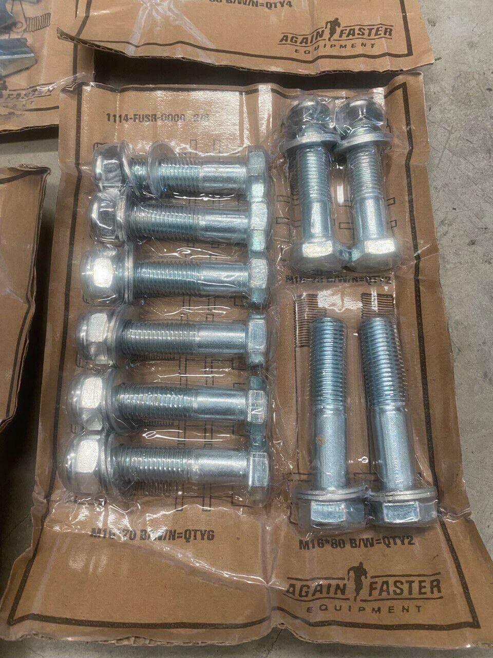 Bulk lot of silver hex head bolts, nuts, and screws in plastic packaging on cardboard backing.