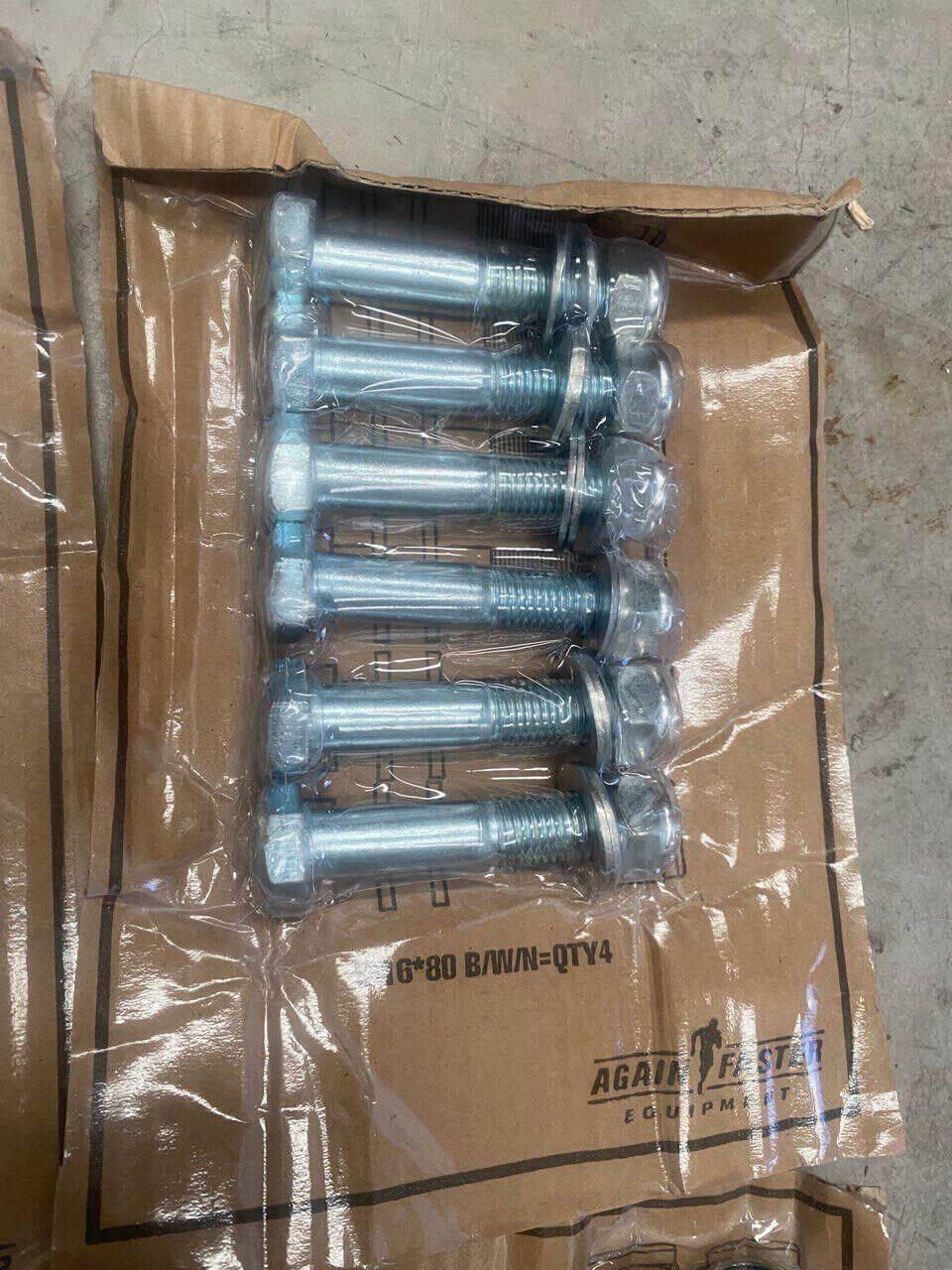 Bulk lot of metal hex bolts and nuts on cardboard packaging for gym or machinery use