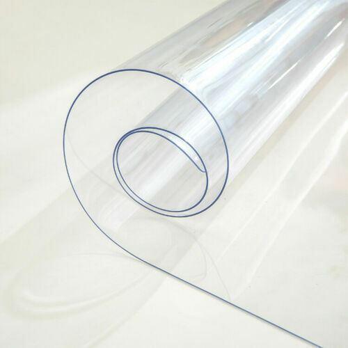 Rolled clear PVC tablecloth cover protector, durable and waterproof for dining tables.