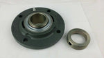 Round flange bearing housing with metal collar, industrial bearing part on white background