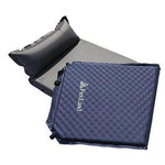 Blue self-inflating camping sleeping pad with attached pillow, compact and lightweight.