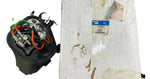 Bendix truck brake module with colorful wires next to original white packaging box