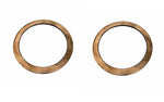 Pair of circular metal thrust washers for truck or tractor parts on white background
