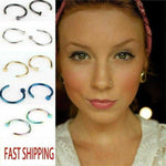 Assorted nose, lip, and ear hoop rings in various colors shown with close-up of woman wearing a nose ring.