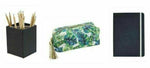 Black pencil holder with pencils, a green leaf print makeup or pencil pouch, and a closed black notebook