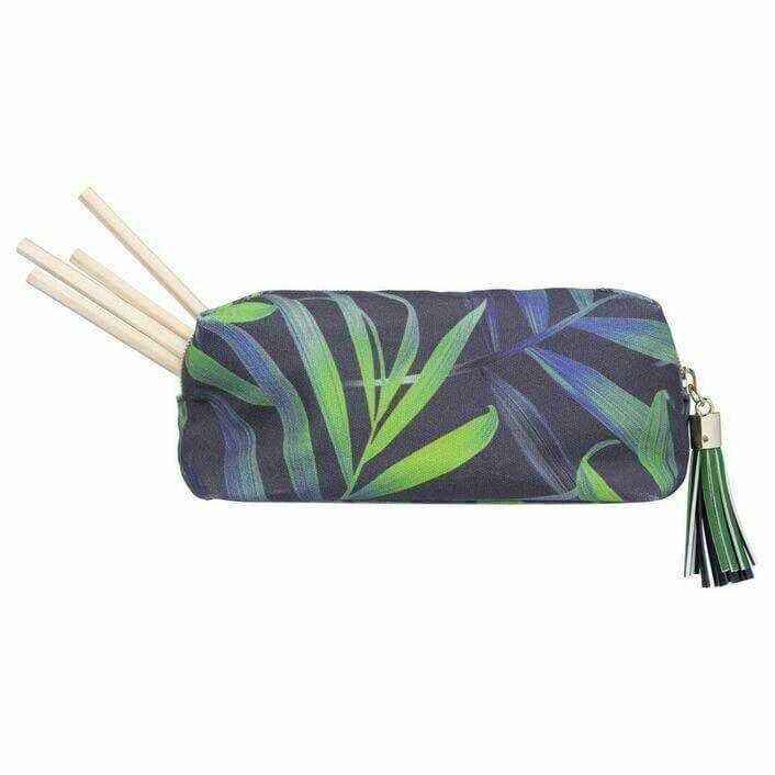 Leaf print portable makeup bag with zipper, tassel detail, and wooden makeup brushes inside